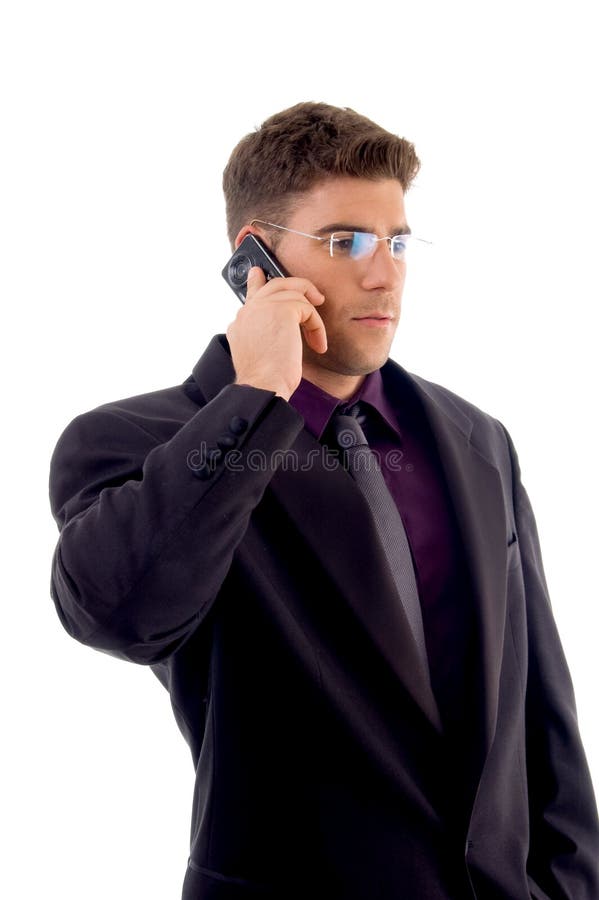 Young service provider communicating on cell phone