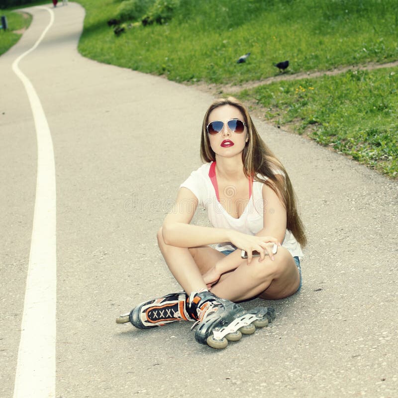 Young sexy brunette woman portrait in sunglasses.