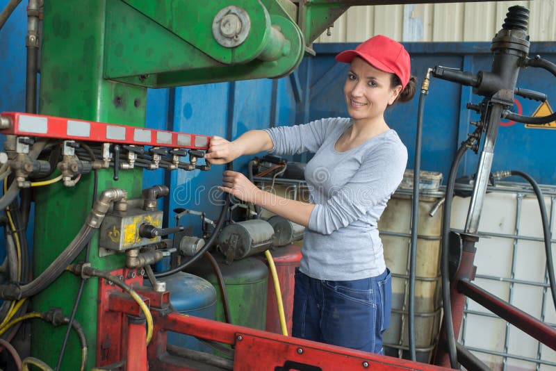 Young Brunette Woman Working As Industrial Mechanic