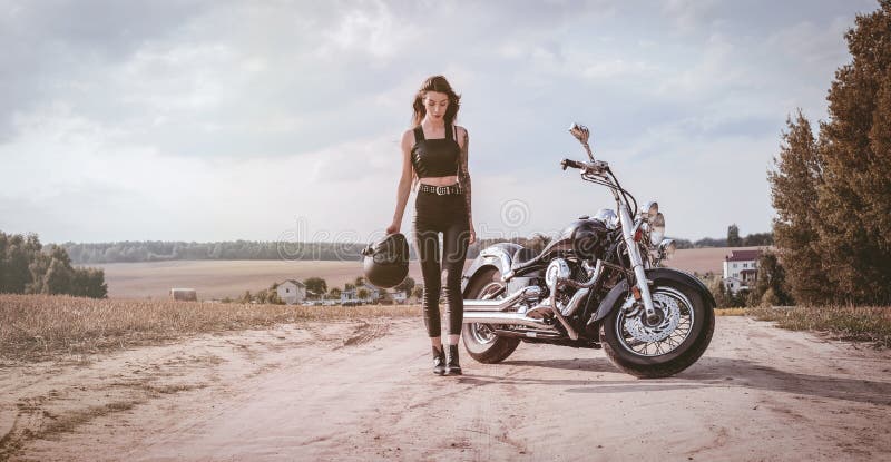 Young Girl with a Helmet in Her Hand Walks Along the Road on the Background  of a Motorcycle. Travel Concept Stock Image - Image of motorcycle, leather:  227173223