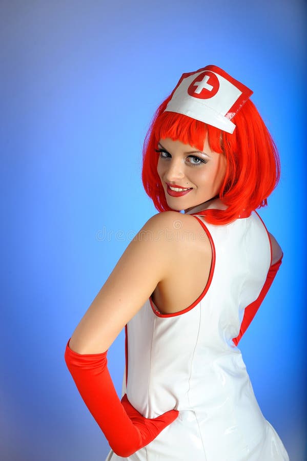 Young nurse with red hair stock photo. Image of cross 13942862