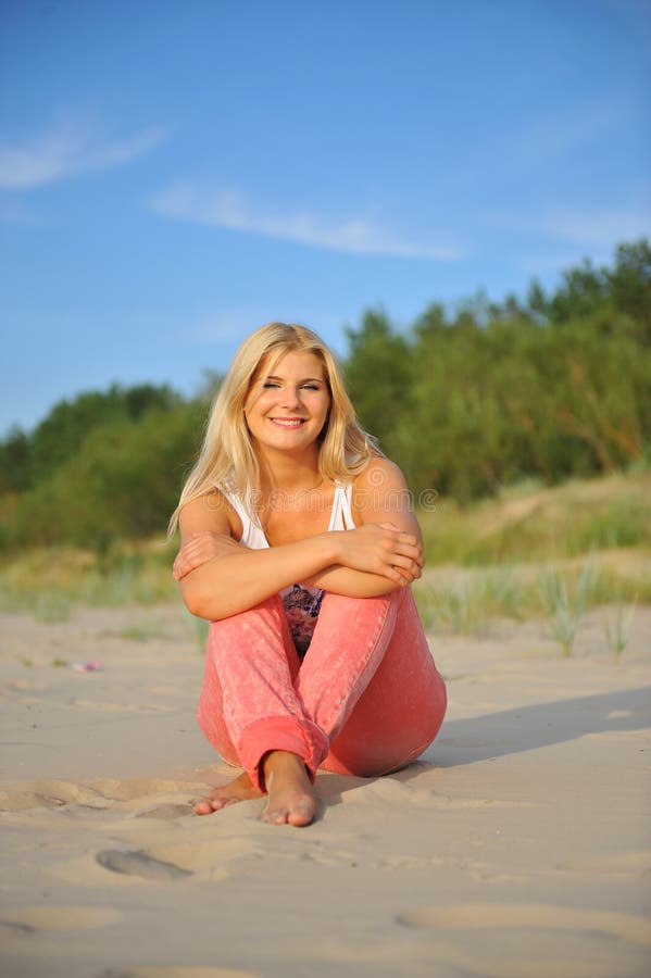 Young summer woman relaxing on the beach