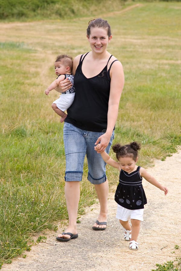 Young single mother family walking