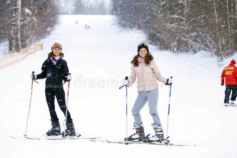 Young sisters with ski stand at the hill royalty free stock images Young sisters with ski stand at the hill royalty free stock images