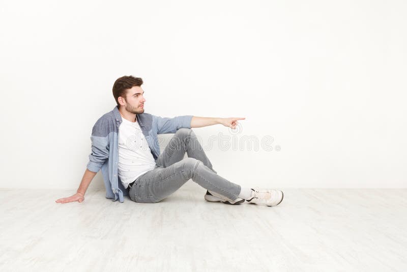 Young sitting confident man point away stock photography Young sitting confident man point away stock photography