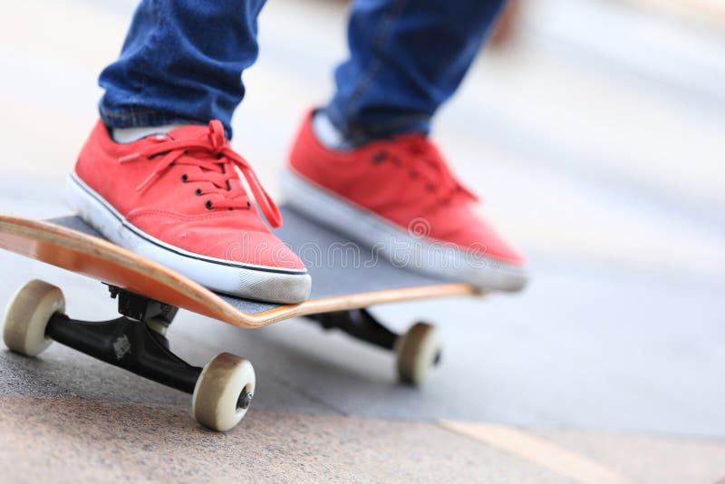 Young skateboarder legs riding on skateboard stock photos Young skateboarder legs riding on skateboard stock photos