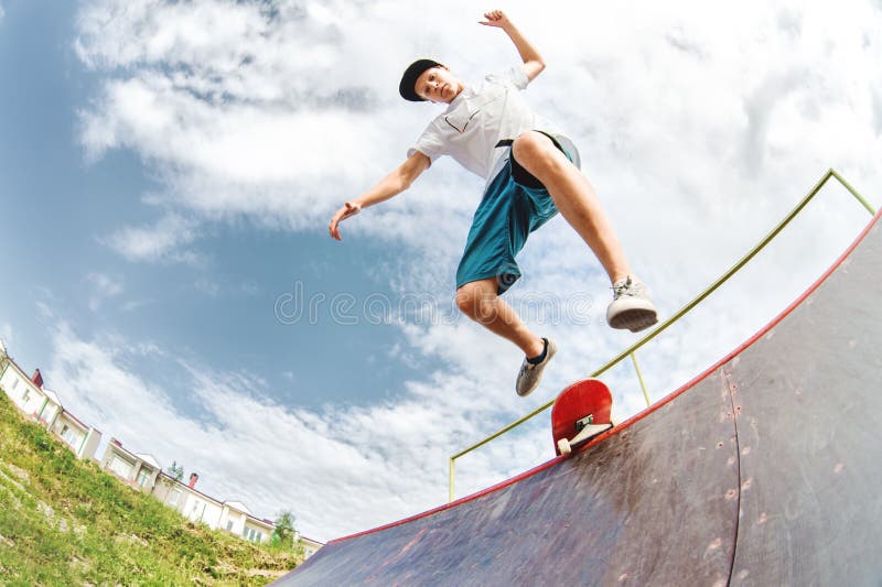 Young Skater Jumps from Ramp Down Stock Photo - Image of board, city ...