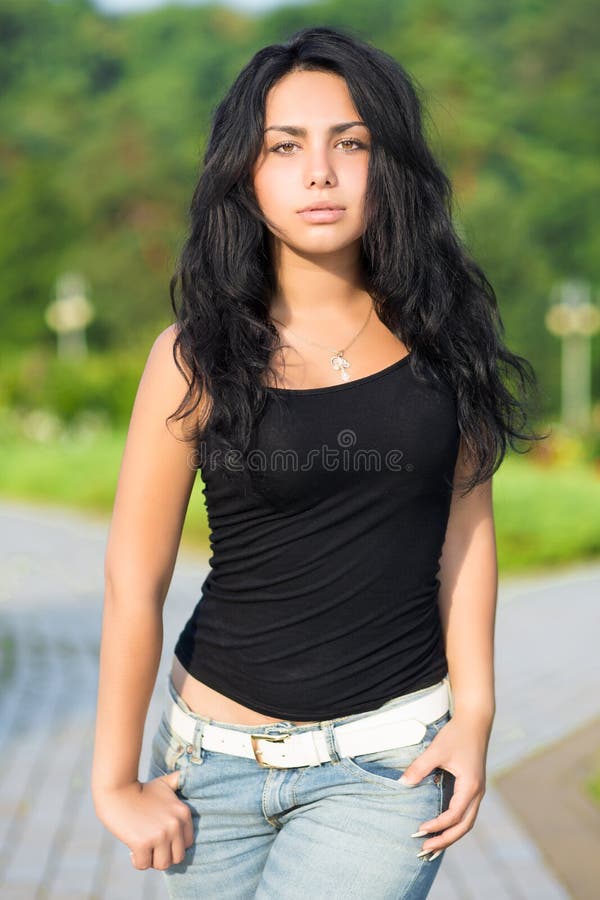 Slim brunette with purse stock photo. Image of attractive - 75801006