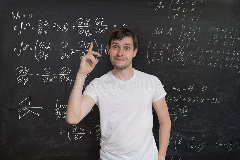 Young smart student has an idea how to solve difficult mathematical problem. Math formulas on blackboard in background