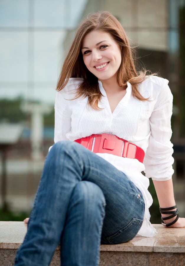 Young smiley woman sitting