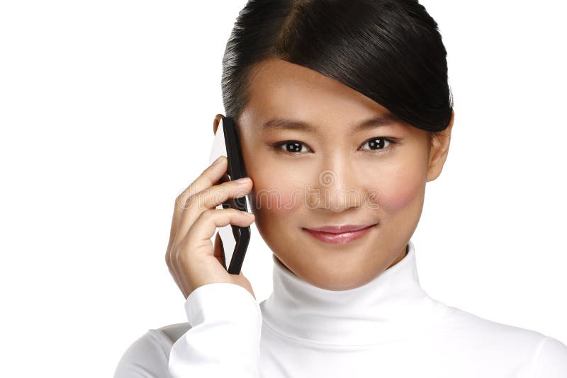 Young smiling asian business woman calling with mobile phone royalty free stock image Young smiling asian business woman calling with mobile phone royalty free stock image