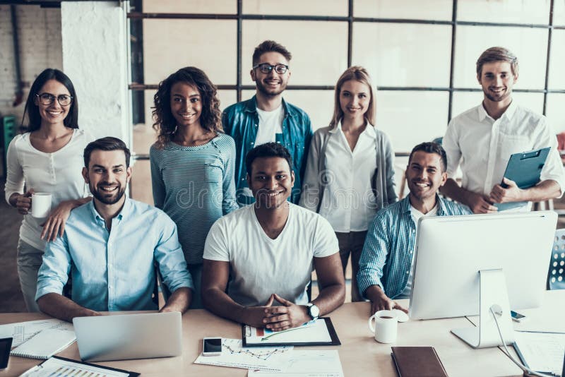 Young Smiling Business People Working in Office