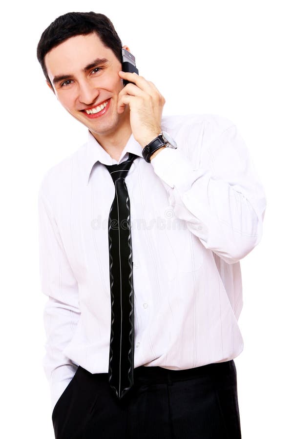 Young smiling businessman using cell phone