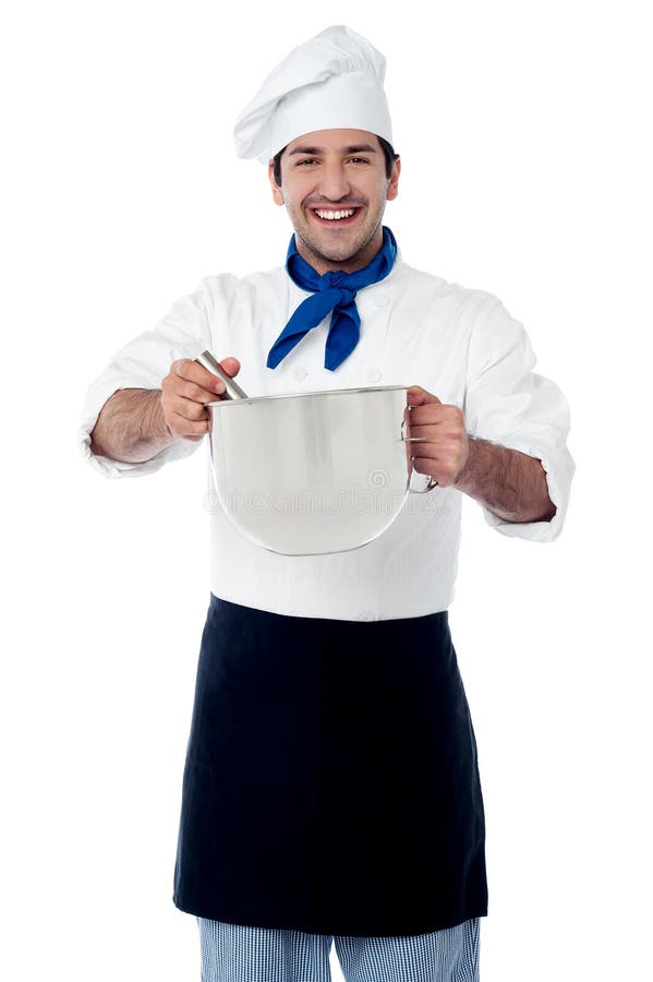 Young smiling confident male chef stock images