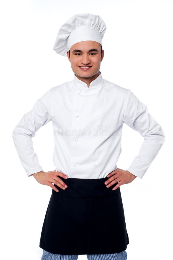 Young smiling confident male chef royalty free stock image