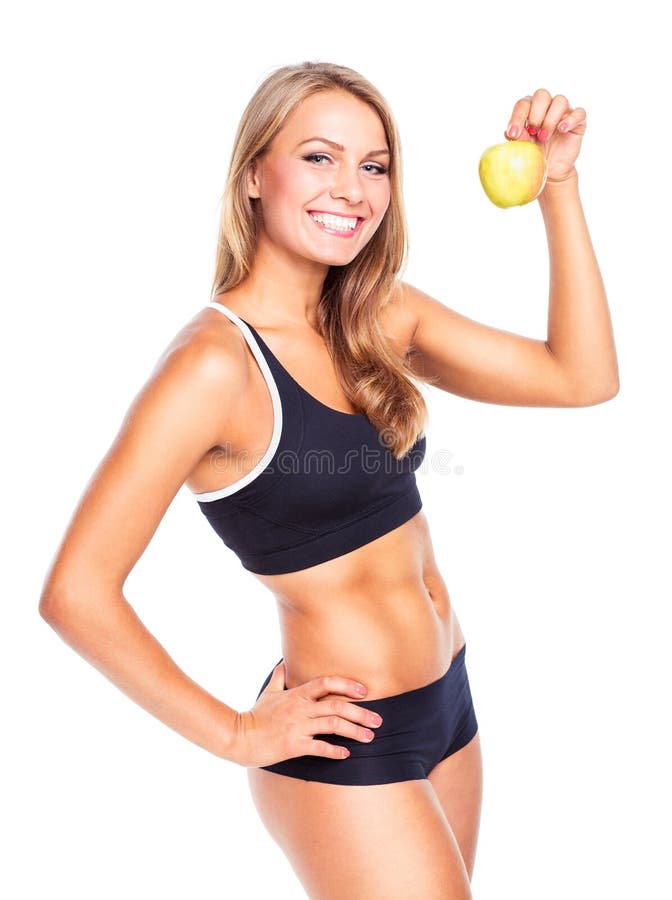 Young smiling girl holding green apple in hand