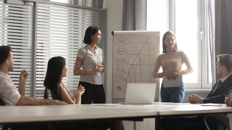 Young smiling mixed race presentation speaker providing seminar. stock images Young smiling mixed race presentation speaker providing seminar. stock images