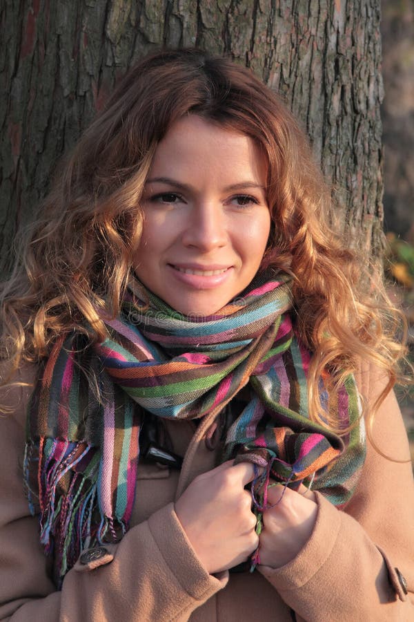 Young, smiling and pretty woman in the autumn park royalty free stock images Young, smiling and pretty woman in the autumn park royalty free stock images