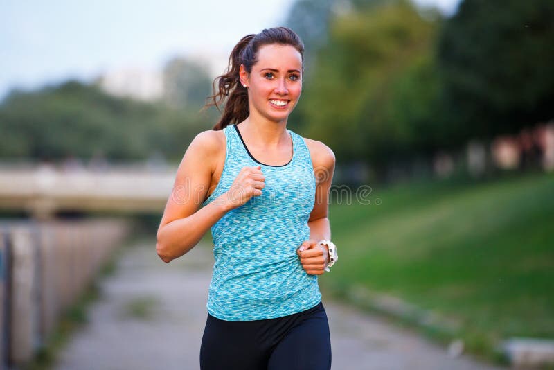 Young Smiling Woman Running in Park in the Morning Stock Image - Image ...