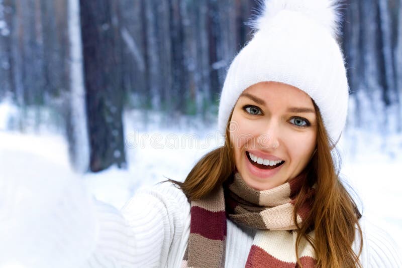 Young Smiling Woman Doing a Selfie in Winter Forest Stock Photo - Image ...