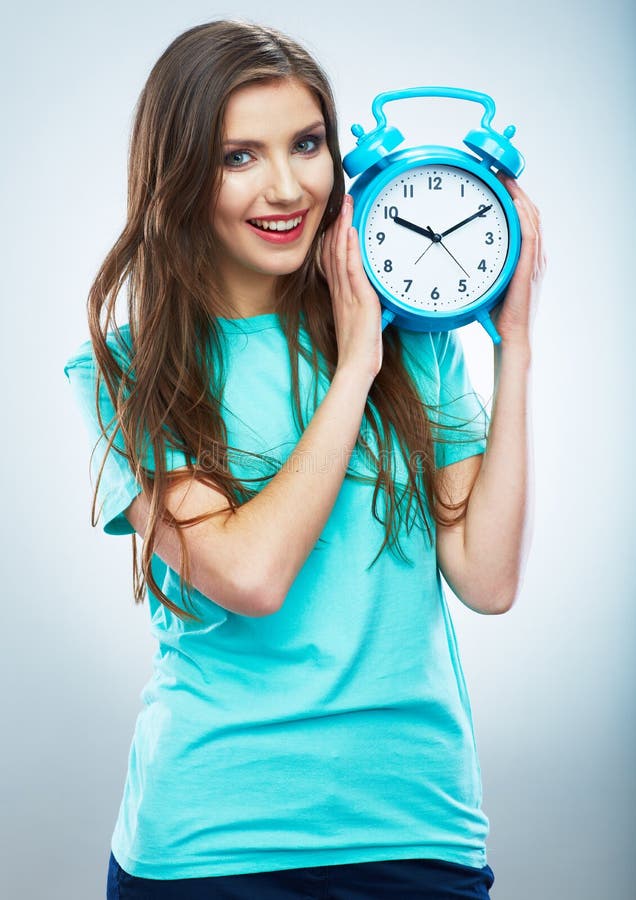 Young smiling woman hold watch. Beautiful smiling girl portrait stock image Young smiling woman hold watch. Beautiful smiling girl portrait stock image