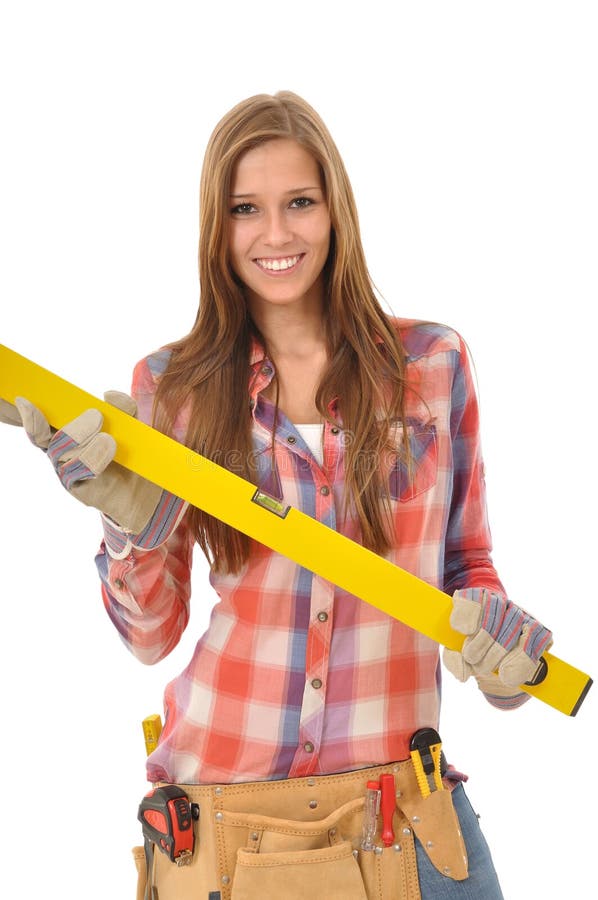 Young smiling woman holding spirit level