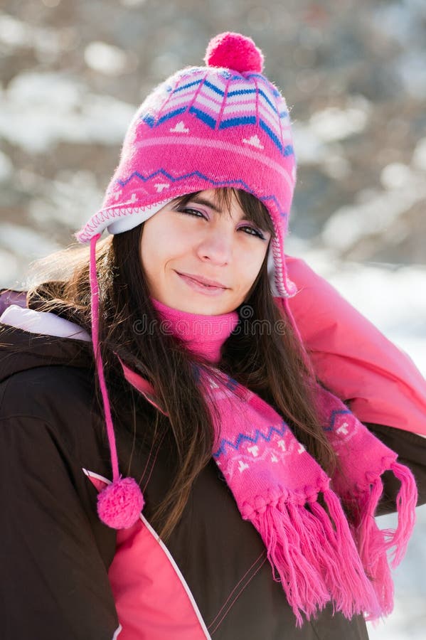 Young and smily girl in sunny winter day