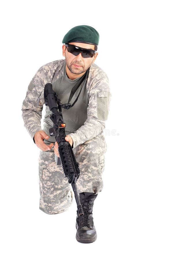Young Soldier With Beret And Glasses Holding An Automatic Gun Stock
