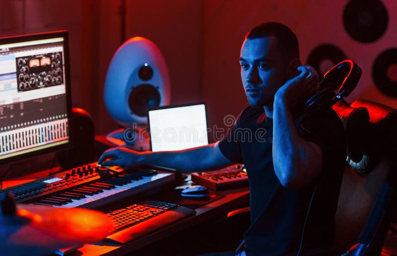 Young Soung Engineer Working and Mixing Music Indoors in the Studio