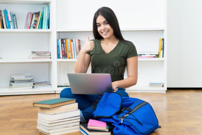 Young spanish computer science student with laptop royalty free stock photo