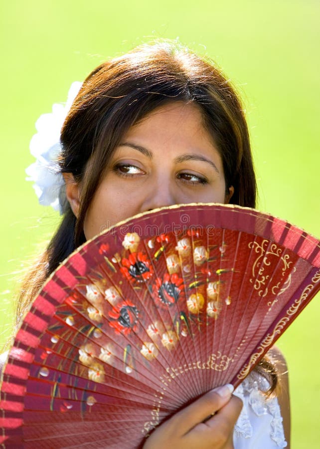 Young Spanish girl or woman holding traditional fan stock image Young Spanish girl or woman holding traditional fan stock image
