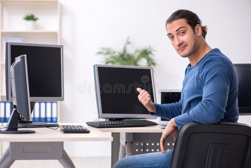 Young male it specialist working in the office stock images