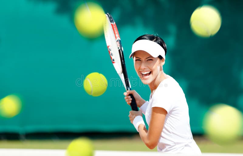 Young sportive woman plays tennis