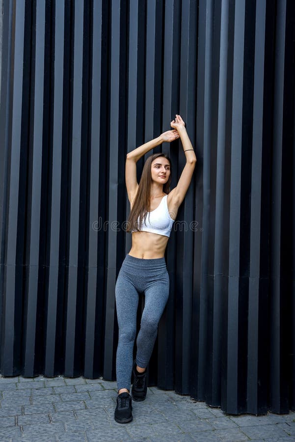 Sportive and Very Slim Woman Posing Outdoors on Abstract Background ...