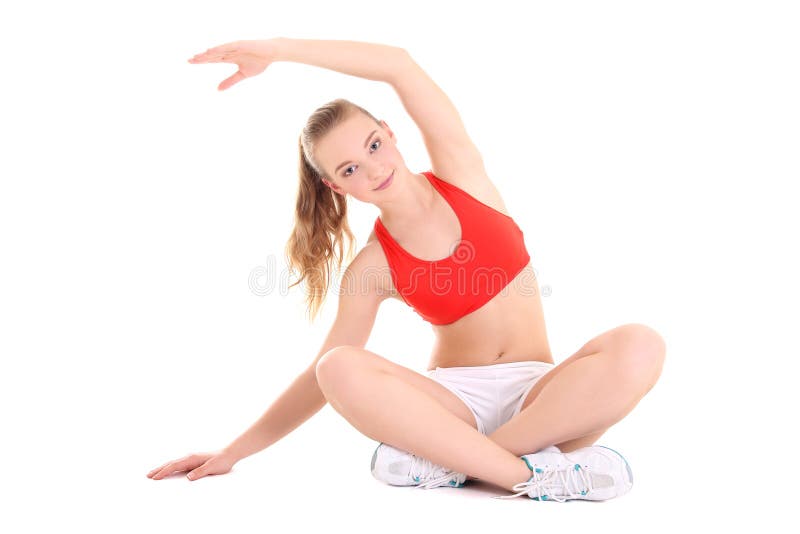 young sporty woman doing stretching exercise over white background