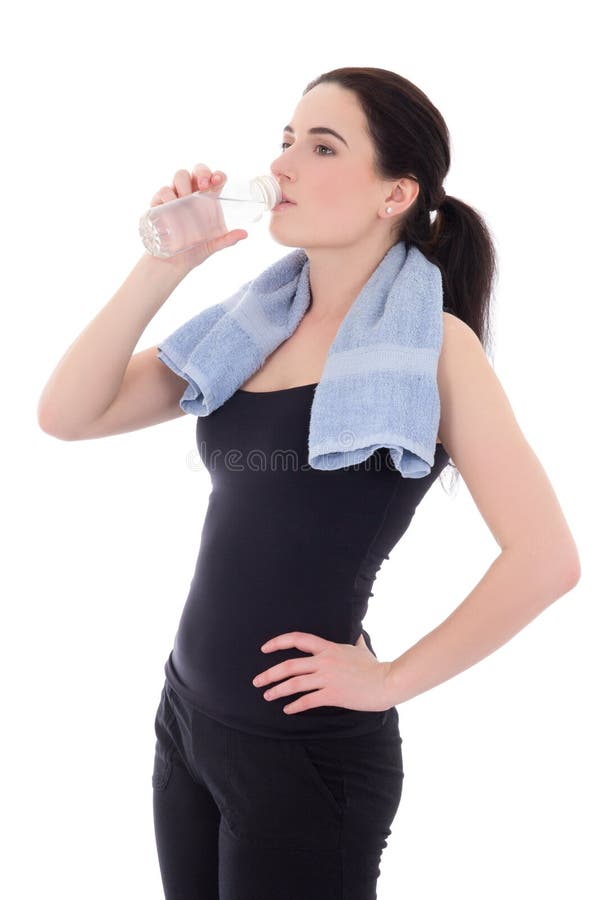 Young sporty woman drinking water isolated on white