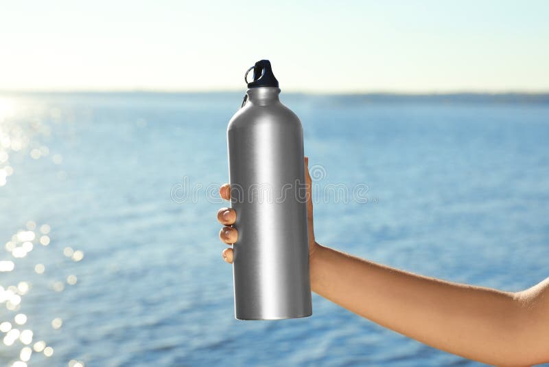 Woman Holding Water Bottle Stock Photo, Picture and Royalty Free Image.  Image 26195006.