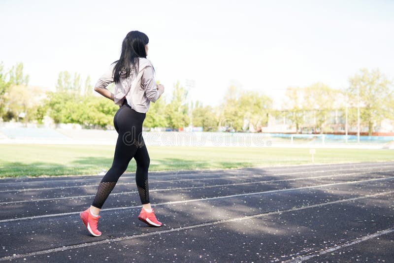 Young sporty woman running in the morning. Fitness girl. sport background with copy space. concept of healthy life royalty free stock photo Young sporty woman running in the morning. Fitness girl. sport background with copy space. concept of healthy life royalty free stock photo