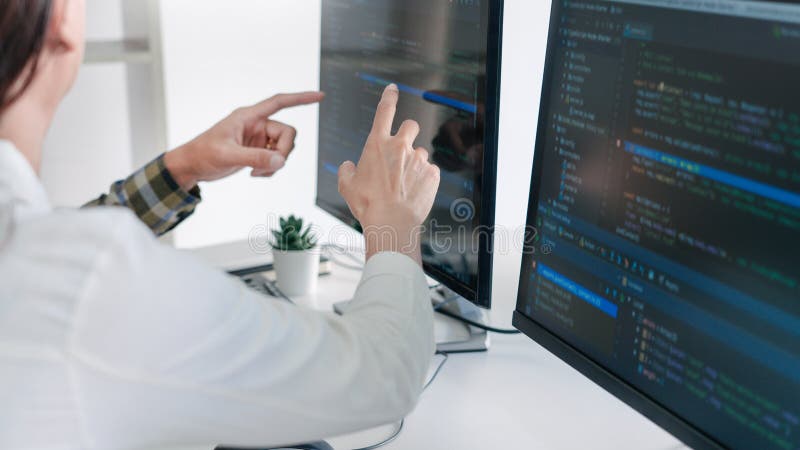 Young startup Programmers Sitting At Desks Working On Computers screen for Developing programming and coding to find solution to problem on New Application. Program coding working stock images, royalty-free photos and pictures