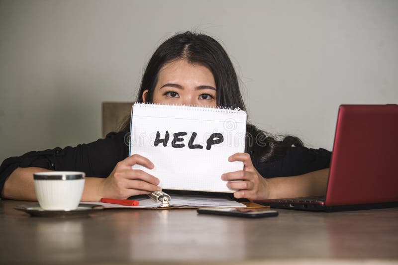 Young stressed and depressed Asian Chinese businesswoman working overwhelmed and exhausted as corporate business employee asking f royalty free stock photo Young stressed and depressed Asian Chinese businesswoman working overwhelmed and exhausted as corporate business employee asking f royalty free stock photo