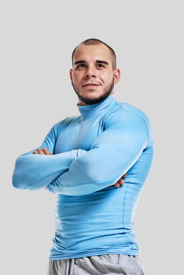 Bodybuilder crossing hands stock images