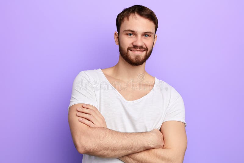 Young strong caucasian man standing with crossed arms stock images Young strong caucasian man standing with crossed arms stock images