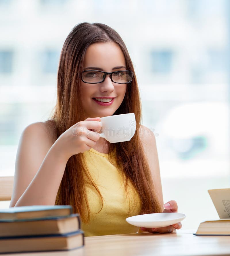 Young Student Drinking Coffee Sudying Stock Photos Free & Royalty