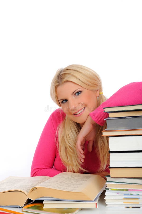 Young student girl with lots of books