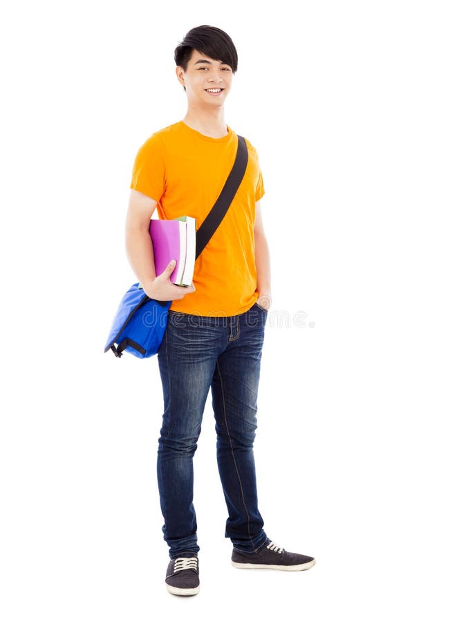 Young student standing and holding books