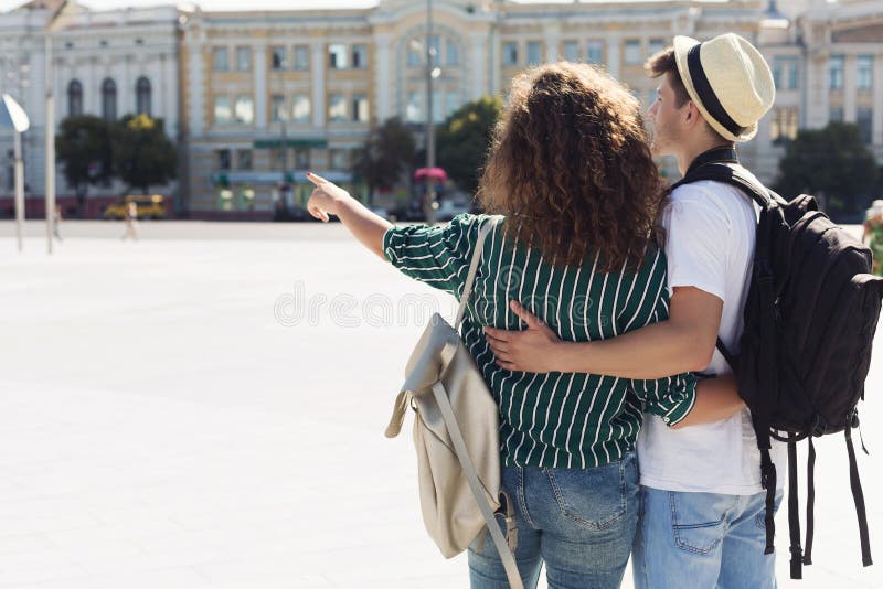 Young stylish couple hugging in the city stock image Young stylish couple hugging in the city stock image
