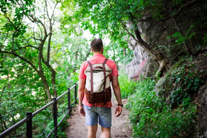 Young man walking in the woods