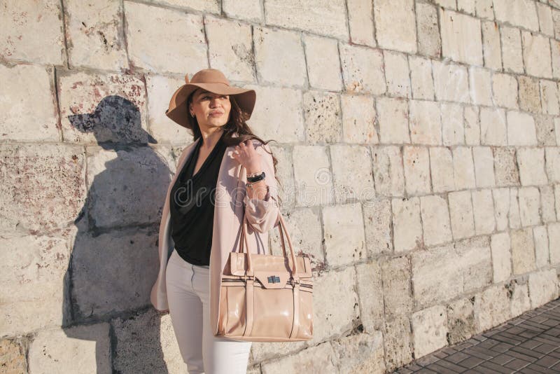 Plus size model wearing fashion clothes in city street stock photo Plus size model wearing fashion clothes in city street stock photo