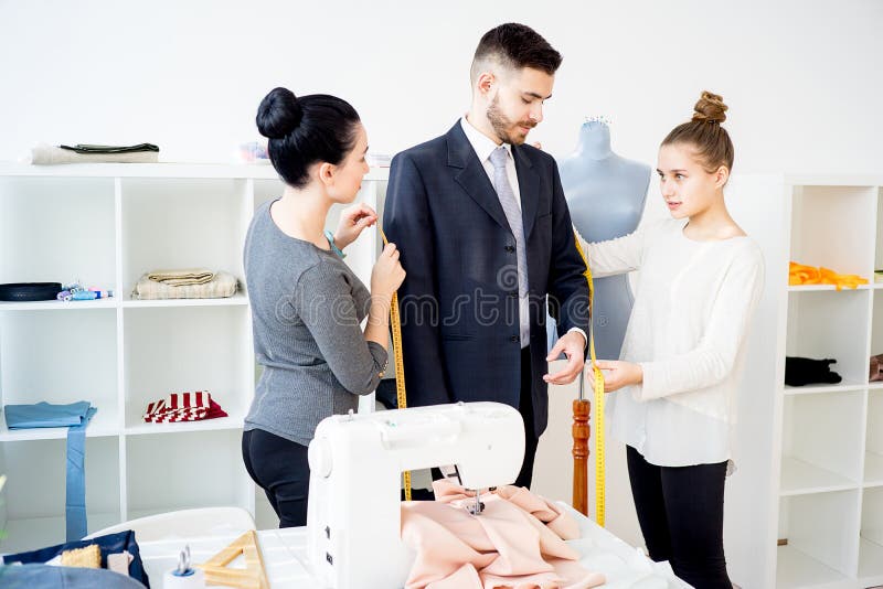 Young tailors at work stock photo. Image of style, dressmaker - 89729954