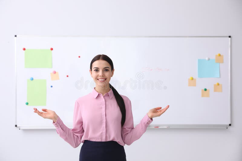 Young Teacher Near Whiteboard in Classroom Stock Photo Image of class